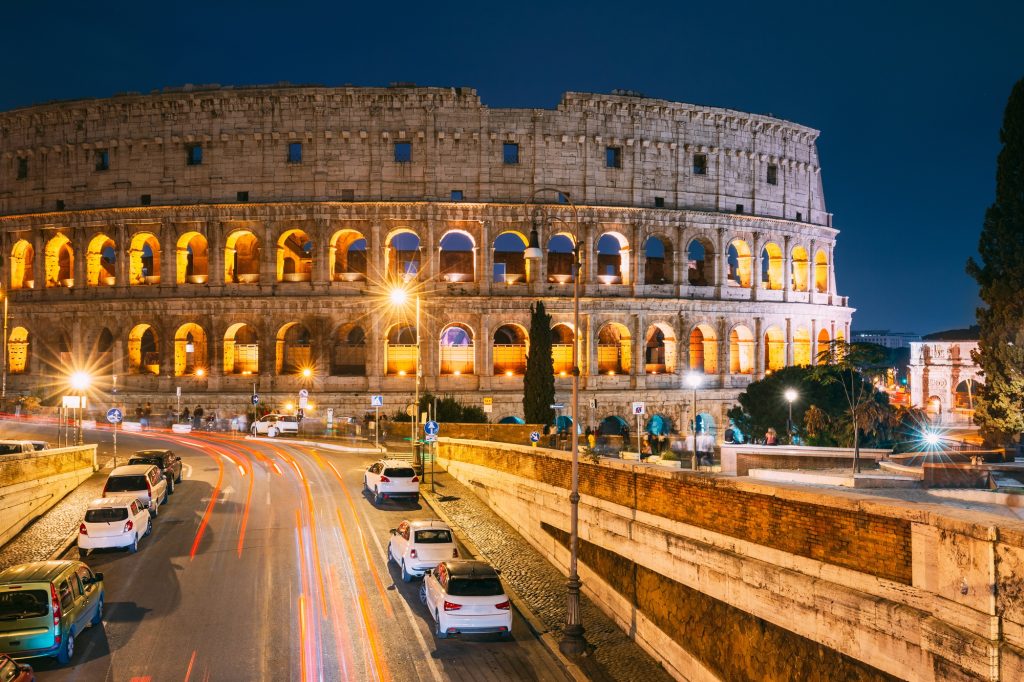 Rome, Italy. Colosseum Also Known As Flavian Amphitheatre In Evening Or Night Time